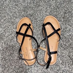Tan sandals with black straps